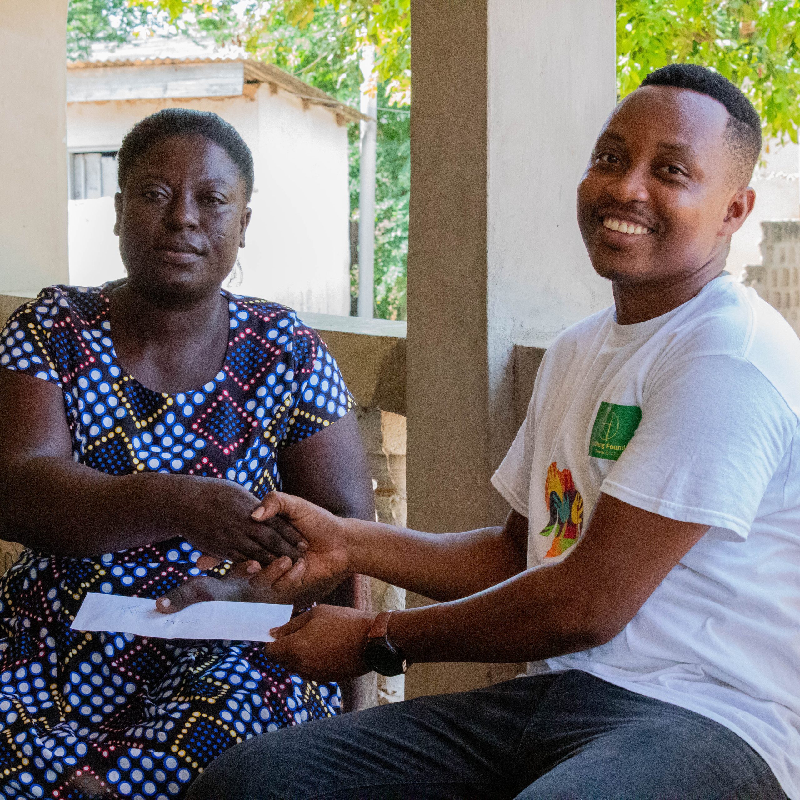 Donation to Madam Mary at Achimota, Chantan.